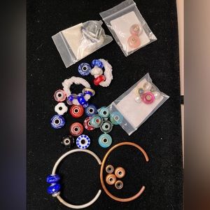 Assorted glass/ sterling silver Trollbeads w/ starling silver band & brass band